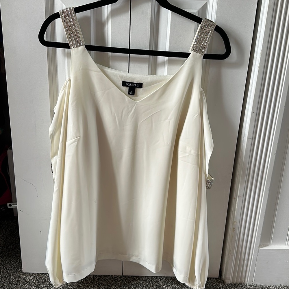 Party top - long sleeved with slits in sleeves and dazzling rhinestones.
